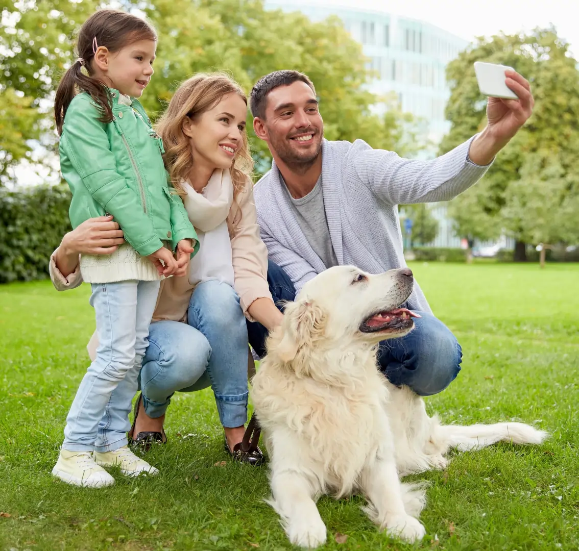 Scoop Heroes | Dog Image | Happy family taking a selfie with their dog